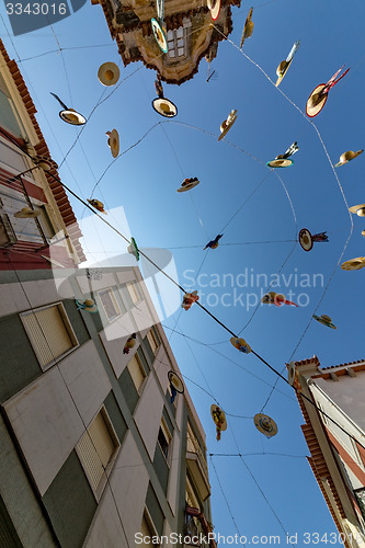 Image of City Streets Decorated with Straw Hats