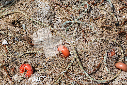 Image of Pile Fishing Net with Red Floats