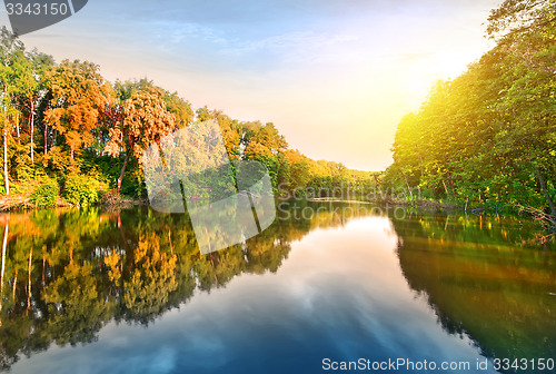 Image of Pink sunrise over river