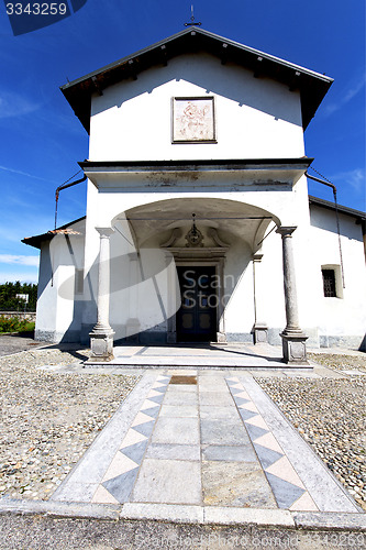 Image of  church  in  the villadosia  old   closed brick tower sidewalk i