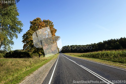 Image of passing an empty asphalt road  