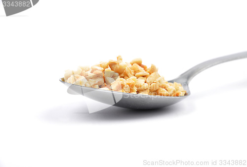 Image of Minced hazelnuts on spoon