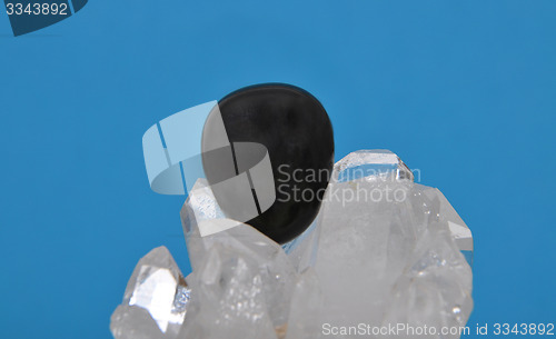 Image of Obsidian on rock crystal