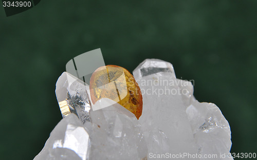 Image of Amber on rock crystal