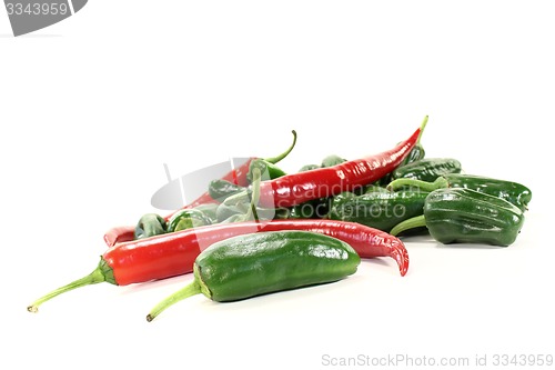 Image of green Pimientos with red hot peppers