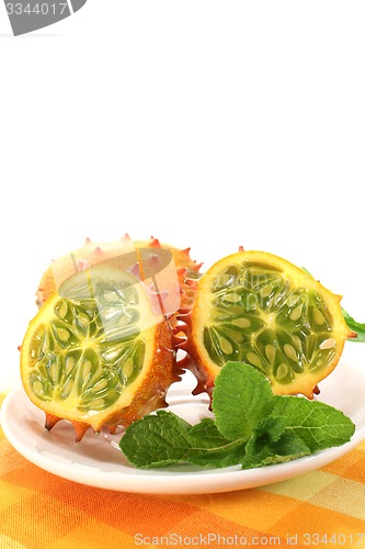 Image of horned melon on a plate with napkin