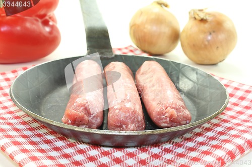 Image of Salsiccia with peppers and onions in a pan