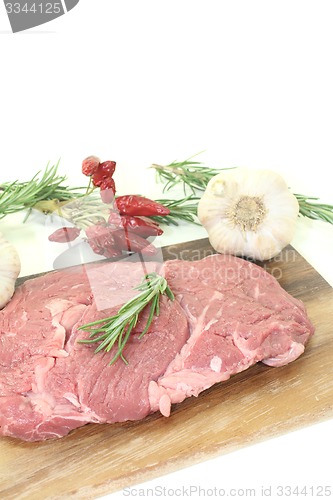 Image of Ribeye steak with garlic, chilli and rosemary