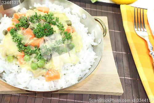 Image of chicken frikassee with rice and mushrooms