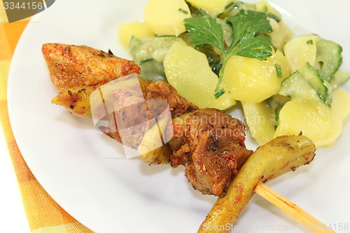 Image of Potato-cucumber salad with fire skewers