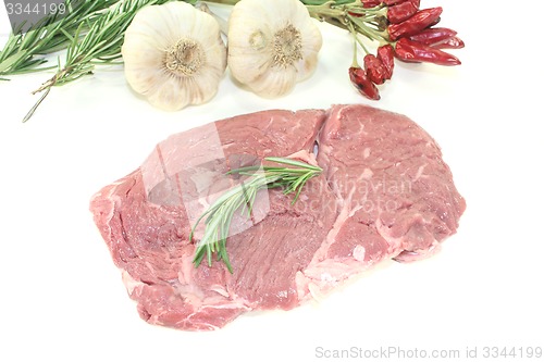 Image of fresh raw Ribeye steak with rosemary