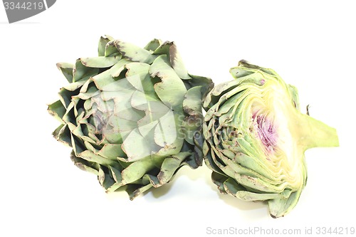 Image of sliced and whole artichokes