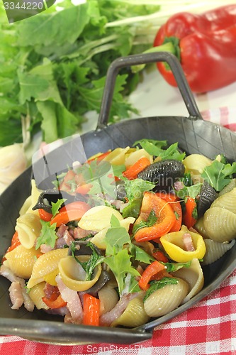 Image of colorful pasta pan with tomatoes