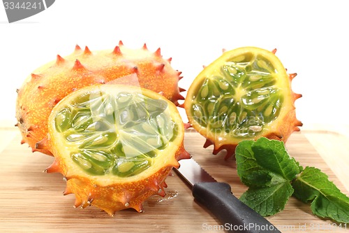 Image of sliced horned melon on a wooden board