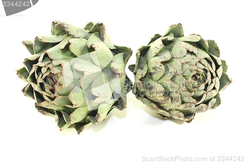 Image of two whole artichokes