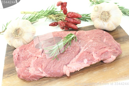 Image of Ribeye steak with garlic and rosemary