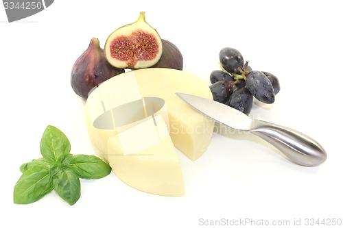 Image of Cheese piece with knife
