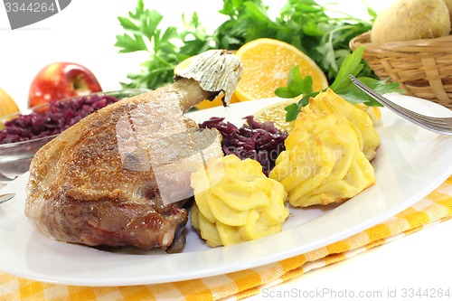 Image of Duck leg with red cabbage
