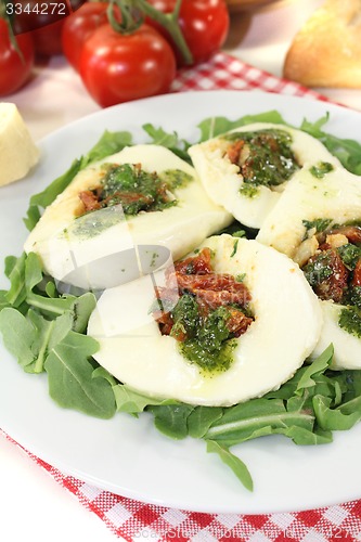 Image of stuffed mozzarella with arugula