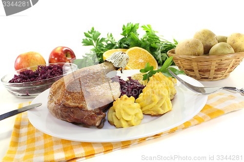 Image of fresh Duck leg with red cabbage