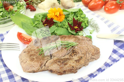 Image of Sirloin steak with wild herb salad