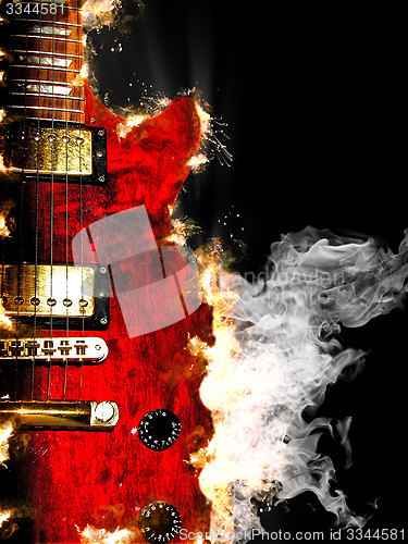Image of electric guitar burning in fire