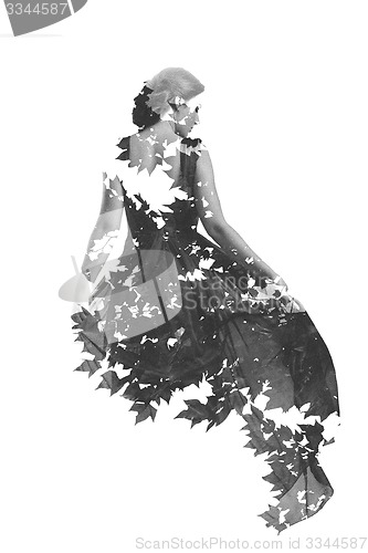 Image of double exposure of woman and tree