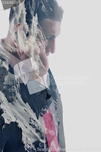 Image of double exposure of  business man with  mobile phone and mountain
