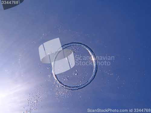 Image of Bubble ring  from the air rises upwards the sun.