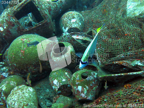 Image of massive shipwreck, sits on a sandy seafloor in bali