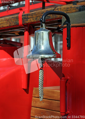 Image of Metal alarm bell on red fire truck
