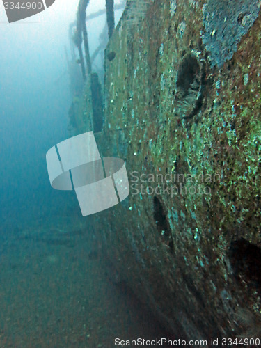 Image of massive shipwreck, sits on a sandy seafloor in bali