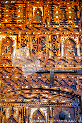 Image of grey metal rusty      morocco in africa the old wood  padlock 