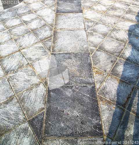 Image of brick in casorate sempione street ll pavement of a curch and mar