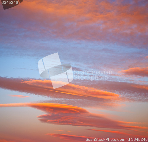 Image of sunrise in the colored sky white soft clouds and abstract backgr