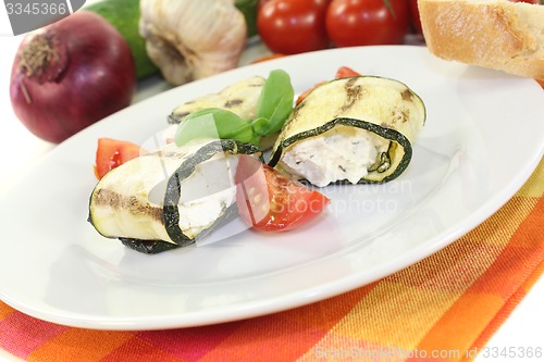 Image of fresh stuffed courgette rolls