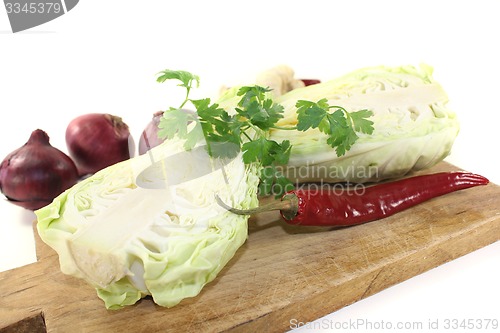 Image of pointed cabbage with parsley and onions