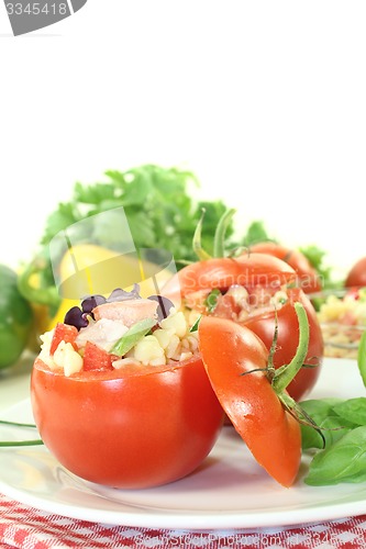 Image of stuffed tomatoes with pasta salad and basil
