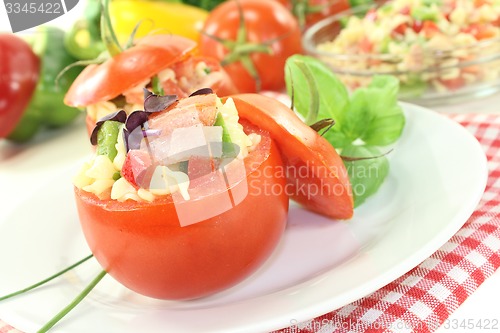 Image of stuffed tomatoes with pasta salad and cress