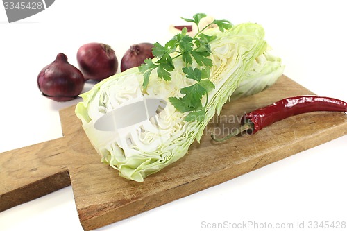 Image of pointed cabbage with parsley and peppers