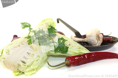 Image of pointed cabbage with parsley and garlic