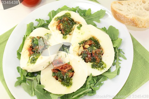 Image of stuffed mozzarella and basil