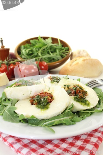 Image of stuffed mozzarella and arugula