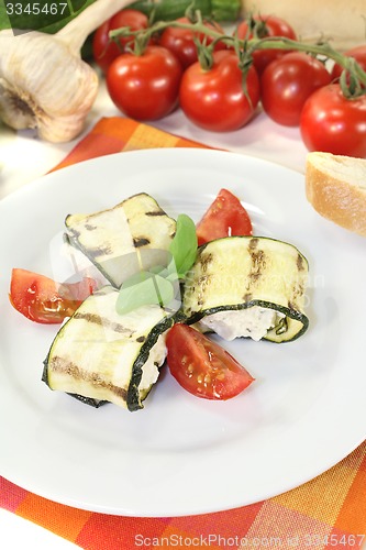 Image of fresh delicious stuffed courgette rolls