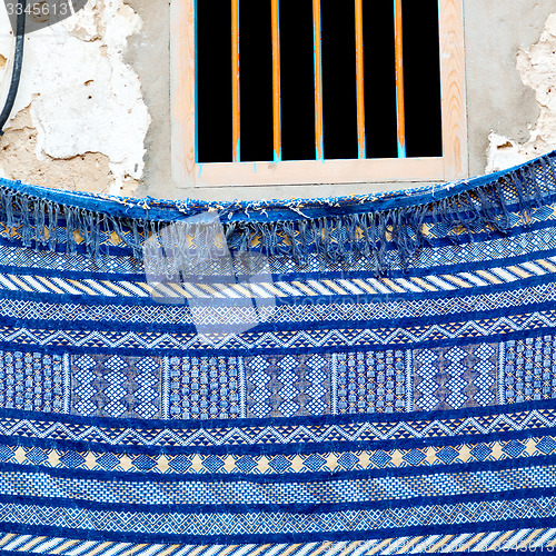 Image of blue window in morocco africa old construction and brown wall re