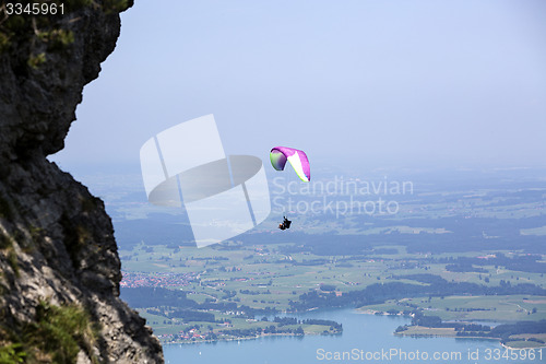 Image of Paraglider flying over Bavarian lake Forggensee