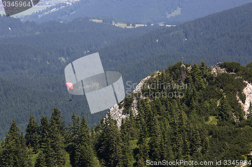 Image of Paraglider flying over Bavarian mountains