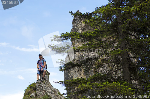 Image of Male hiker on mountain top