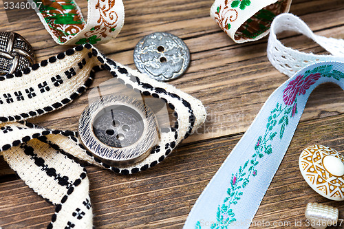 Image of old ribbons, lace, tape and vintage buttons