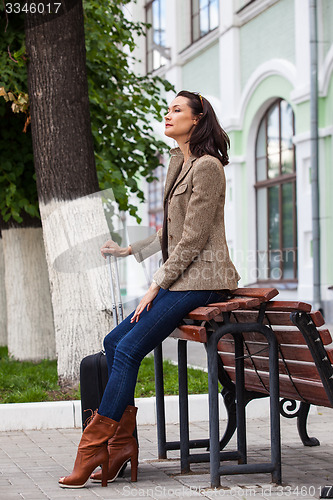 Image of beautiful adult woman traveler